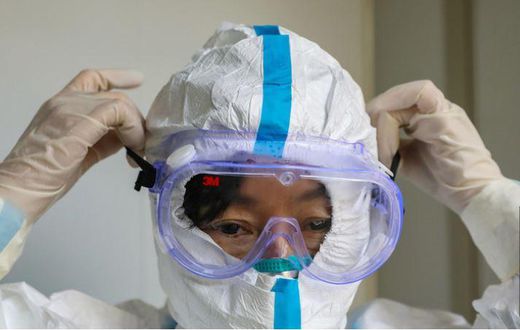 File image of a person wearing a protective facemask