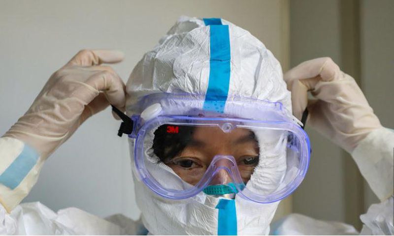 File image of a person wearing a protective facemask