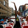 Miss Universe, Zozibini Tunzi (L) waved to crowds who came out to greet her and celebrate her victory