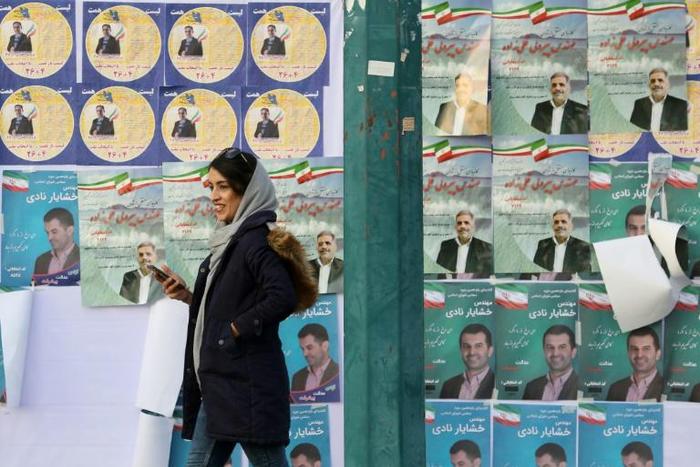 Commentators expect disillusionment among voters in sanctions-hit Iran to result in a low turnout in Friday's parliamentary election despite government appeals for a show of unity