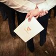 A supporter holds a leaflet with the logo of Thai political party Future Forward, which critics suggested showed links to the Illuminati