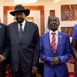 South Sudanese President Salva Kiir (C) embraced Vice-President Riek Machar (L) in a step towards peace