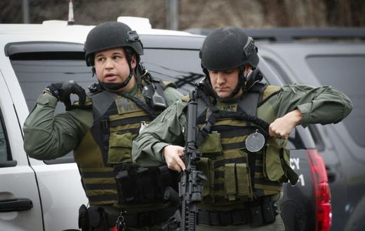 Hundreds of police from New Jersey and New York, including tactical officers armed with rifles and wearing olive-green fatigues, were deployed during the hours-long shootout in Jersey City