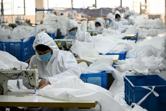 Ugly Duck Industry in Wenzhou, eastern China, has switched production from winter coats to hazmat suits