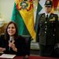 Bolivian Foreign Minister Karen Longaric said Spanish staff had been kept from entering their embassy because they were inappropriately "hooded and armed"