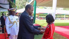 President Uhuru Kenyatta awards decorated athlete Mary Keitany with the OGW title at State House on December 12, 2019