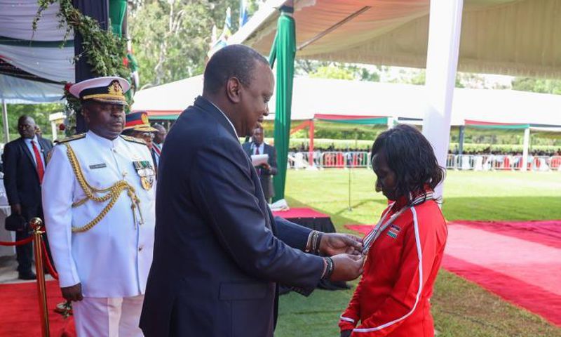 President Uhuru Kenyatta awards decorated athlete Mary Keitany with the OGW title at State House on December 12, 2019