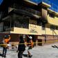 Firefighters speak to a local judge (C) as they point at the Orphanage of the Church of Bible Understanding where a fire broke out the previous night in the Kenscoff area outside of Port-au-Prince February 14, 2020
