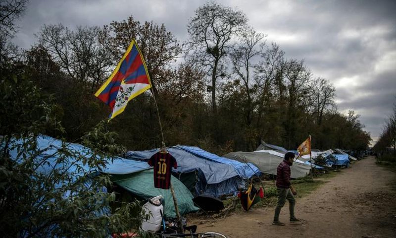 The makeshift camp set up by Tibetan asylum seekers near a  forest in Acheres, northwest of Paris.