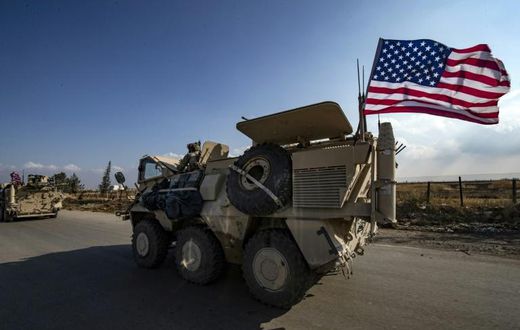 A convoy of US troops is pictured outside the Kurdish-majority city of Qamishli, in Syria's northeastern Hasakeh province on November 2, 2019