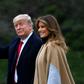 US President Donald Trump waves next to First Lady Melania Trump as they walk to Marine One before departing from the South Lawn of the White House