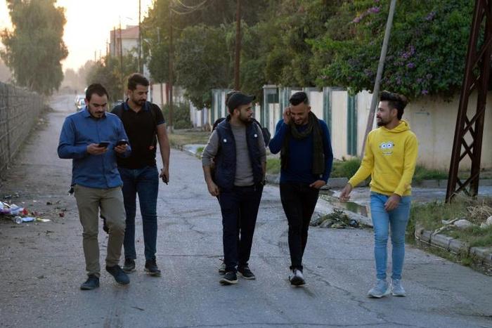 Young men in Iraq's second city Mosul ahead of performing a local adaption of famous Italian resistance song 'Bella Ciao'