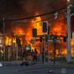 Protesters set a construction site on fire  outside Santiago's Monumental stadium on January 29, 2020, after a fan of the Colo Colo team was run over by a police truck