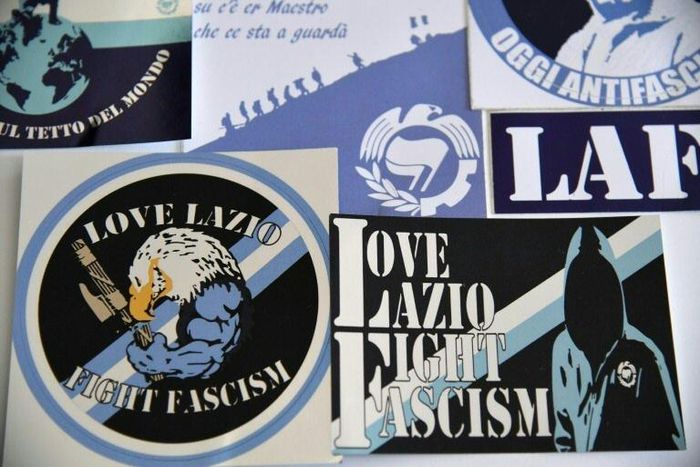Lazio fans distribute 'Fight Facism' stickers