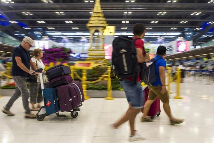 The woman is being treated at hospital after presenting with symptoms at Thailand's biggest airport Suvarnabhumi