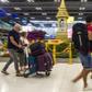 The woman is being treated at hospital after presenting with symptoms at Thailand's biggest airport Suvarnabhumi