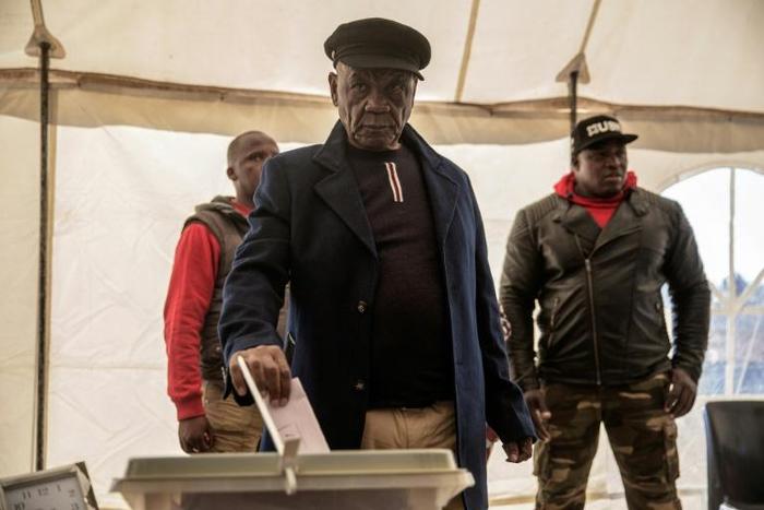 Lesotho Prime Minister Thomas Thabane (C) was summoned by police for questioning over alleged links to the 2017 murder of his estranged wife