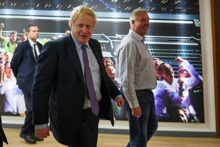 Britain's Prime Minister Boris Johnson during a Conservative Party general election campaign visit to Red Bull Racing in Milton Keynes. Feeling confident he has already published his plans for his first 100 days in office