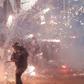 Lebanese counter-protesters threw firecrackers at riot police in central Beirut
