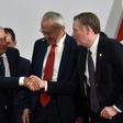 Mexican President Andres Manuel Lopez Obrador (L) shakes hands with US Trade Representative Robert Lighthizer as Mexico's Jesus Seade looks on at the trade pact signing on December 10, 2019 in Mexico City; labor monitoring later became an issue