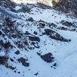 View from a helicopter of the avalanche site. Drones have also been deployed in the search, which has been hampered by deep snow