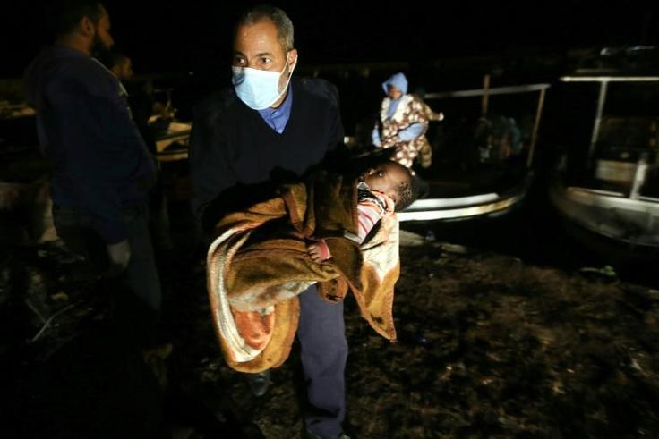 Libya's navy said than 200 migrants were brought to shore from three inflatable boats rescued off the coast west of Tripoli