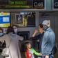Stand-by passengers trying to get out of China make flight enquiries at the airport