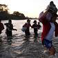 Central American migrants -- mostly Hondurans heading to the US in a caravan -- cross the Suchiate River from Tecun Uman, Guatemala, to Ciudad Hidalgo, Chiapas State, Mexico, on January 23, 2020