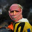 Demonstrators cut roads with flaming tyres in the protest hot spot of the holy Shiite city of Najaf
