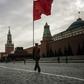 Russian Communist party activists and supporters march towards Lenin's Mausoleum for a ceremony on Red Square in Moscow