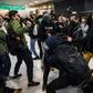 Plainclothes police, with batons, clash with pro-democracy protesters at a Hong Kong shopping mall