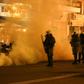Riot police use tear gas during clashes with demonstrators protesting against the construction of controversial new migrant camps on Lesbos island