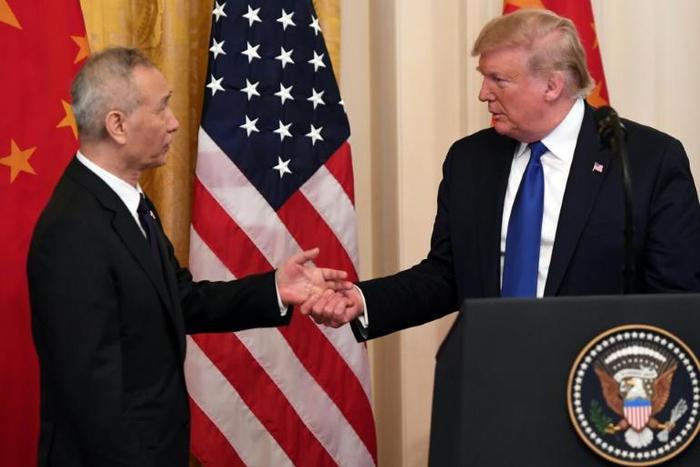 US President Donald Trump, shakes hands during a press conference with China’s Vice Premier Liu He(L), the country’s top trade negotiator, before they sign a trade agreement between the US and China during a ceremony in the White House