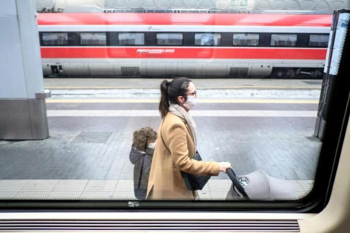 Passengers wear protective masks at Milan's main railway station following security measures taken in northern Italy against  the novel coronavirus. Milan is just north of the main centre of infection.