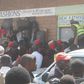 File image of a crowd outside a lodging where a man was caught engaging in sexual acts with a married woman