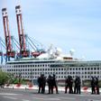 French police officers face demonstrators in Le Port on March 1, 2020, as people protest passengers from the Sun Princess cruise ship on the Indian Ocean island of La Reunion disembarking without having temperatures checked; The incident came hours aft...
