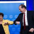 IMF Managing Director Kristalina Georgieva and World Bank Group President David Malpass bump elbows at the end of a joint press briefing on COVID-19 where they called for an all-out, coordinated global response