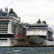 The MSC Merviglia cruise ship (L) lying off Cozumel, Mexico, on February 27, 2020
