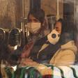 Iranian women wearing protective masks while riding a bus in the Iranian capital Tehran