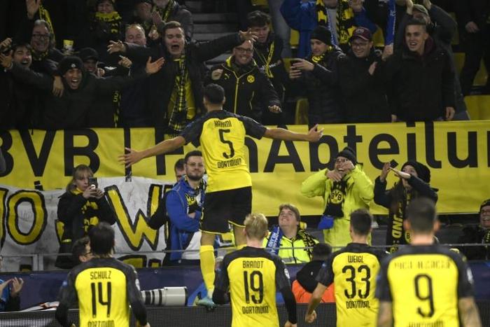 Achraf Hakimi celebrates in front of Borussia Dortmund fans after sealing a 3-2 win over Inter Milan in the Champions League