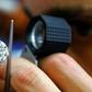 Police say three Romanians staged an elaborate scam to steal three diamonds owned by an Indian gem trader.