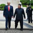 North Korea's leader Kim Jong Un and US President Donald Trump cross south of the Military Demarcation Line that divides North and South Korea, after Trump briefly stepped over to the northern side, on June 30, 2019