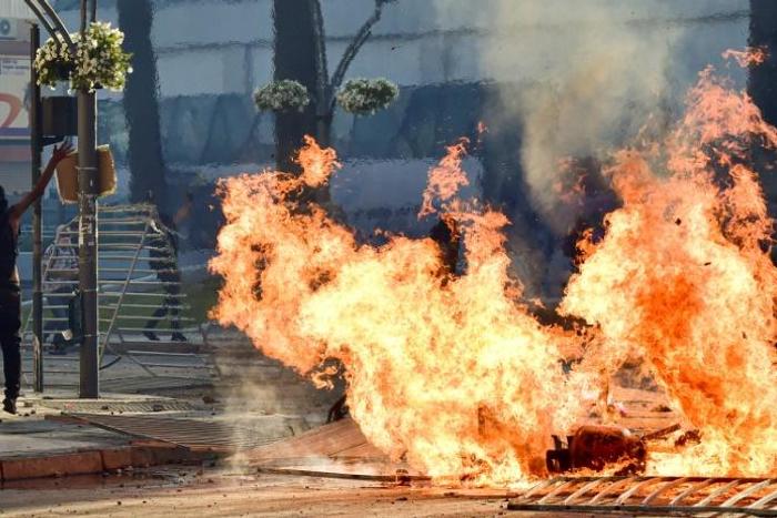 Protestors set fires outside the Vina del Mar music festival in Chile on February 23, 2020