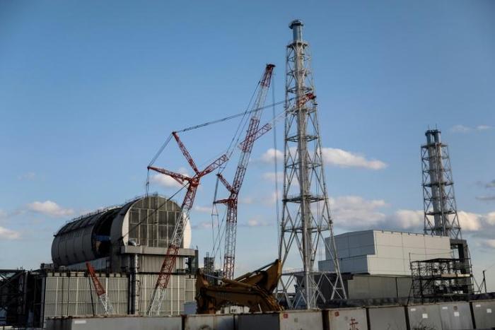 Staff cleaning the Fukushima plant wear special plastic overcoats to prevent radioactive dust settling on clothes or the body