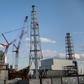 Staff cleaning the Fukushima plant wear special plastic overcoats to prevent radioactive dust settling on clothes or the body