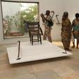 Visitors contemplate artefacts recently returned to Benin and on show at Cotonou's "Petite Musée de la Recade