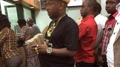 File image of Mike Sonko with a bundle of notes
