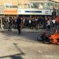 Iranian protesters gather around a burning motorcycle in the city of Isfahan during a demonstration last month against an increase in fuel prices