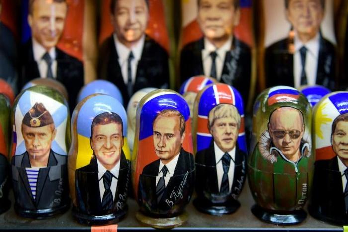 Whether it is commander-in-chief Putin looking through binoculars or mocked-up shirtless Putin riding a bear, the Russian president is on sale everywhere