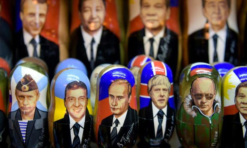 Whether it is commander-in-chief Putin looking through binoculars or mocked-up shirtless Putin riding a bear, the Russian president is on sale everywhere
